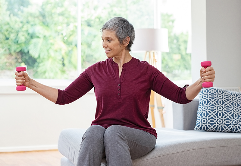 Image of a woman lifting weights