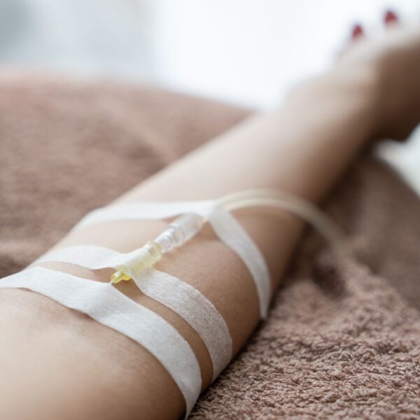 Someone with an IV in their arm