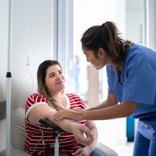Woman getting an IV inserted