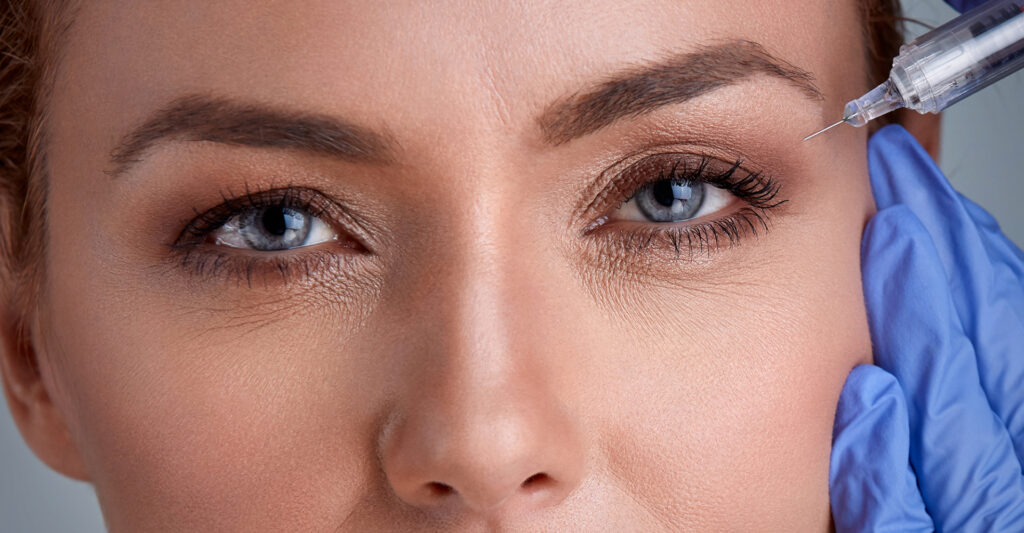 A woman getting botox injections