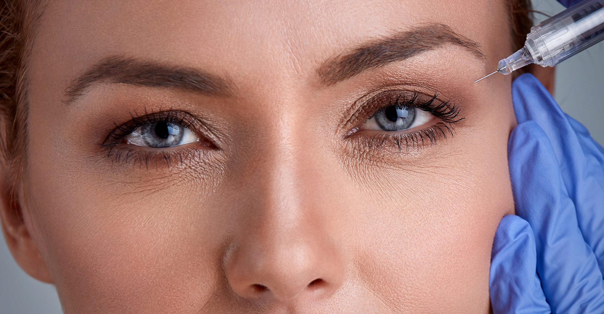 A woman getting botox injections