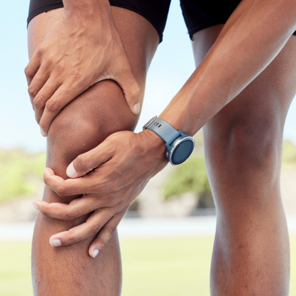 Person holding a sore knee