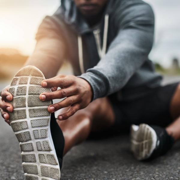 I man stretches outside