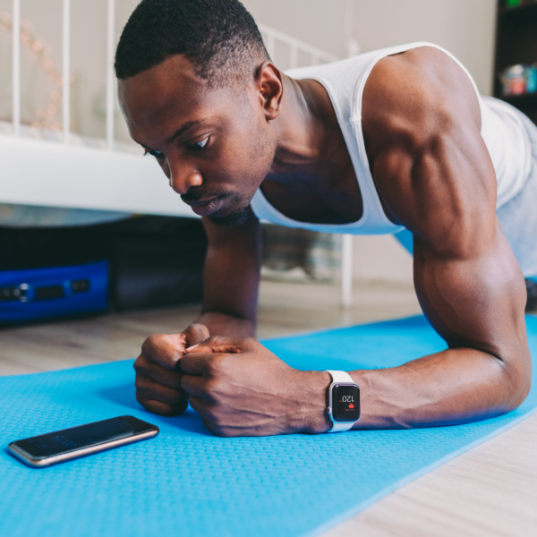 A man exercises in his living room