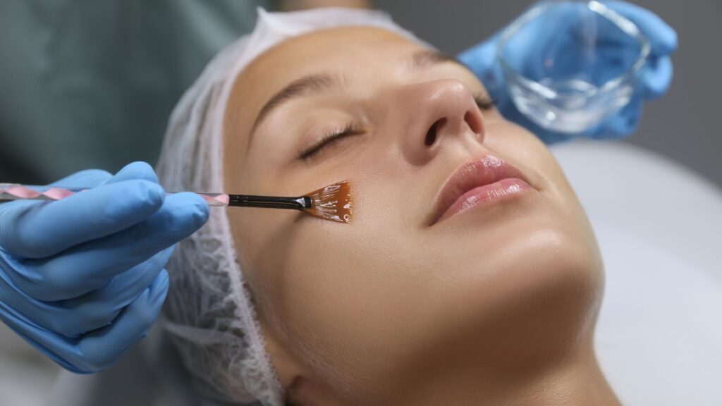woman having chemical peel applied