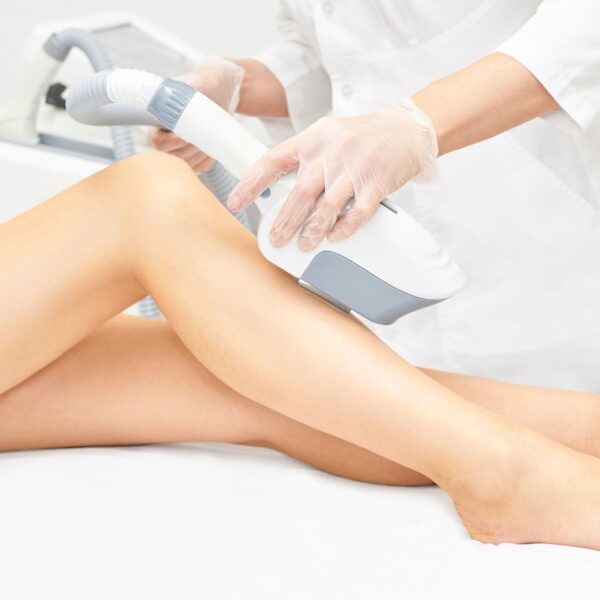 Person getting laser hair removal on their legs. 