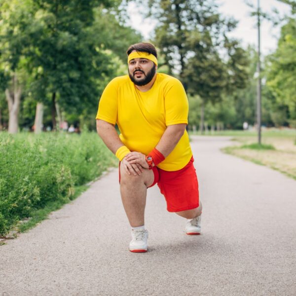 Overweight man exercising