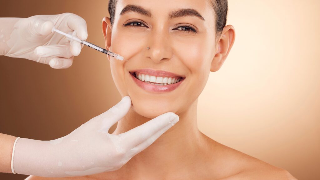 Smiling woman receiving facial filler