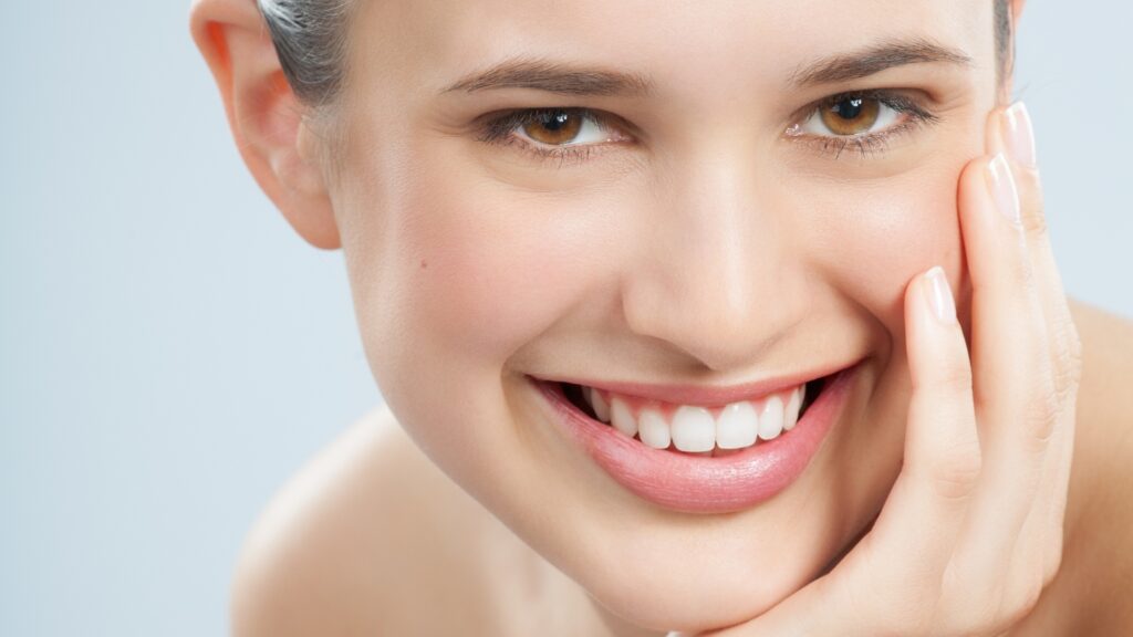 Smiling woman with smooth skin