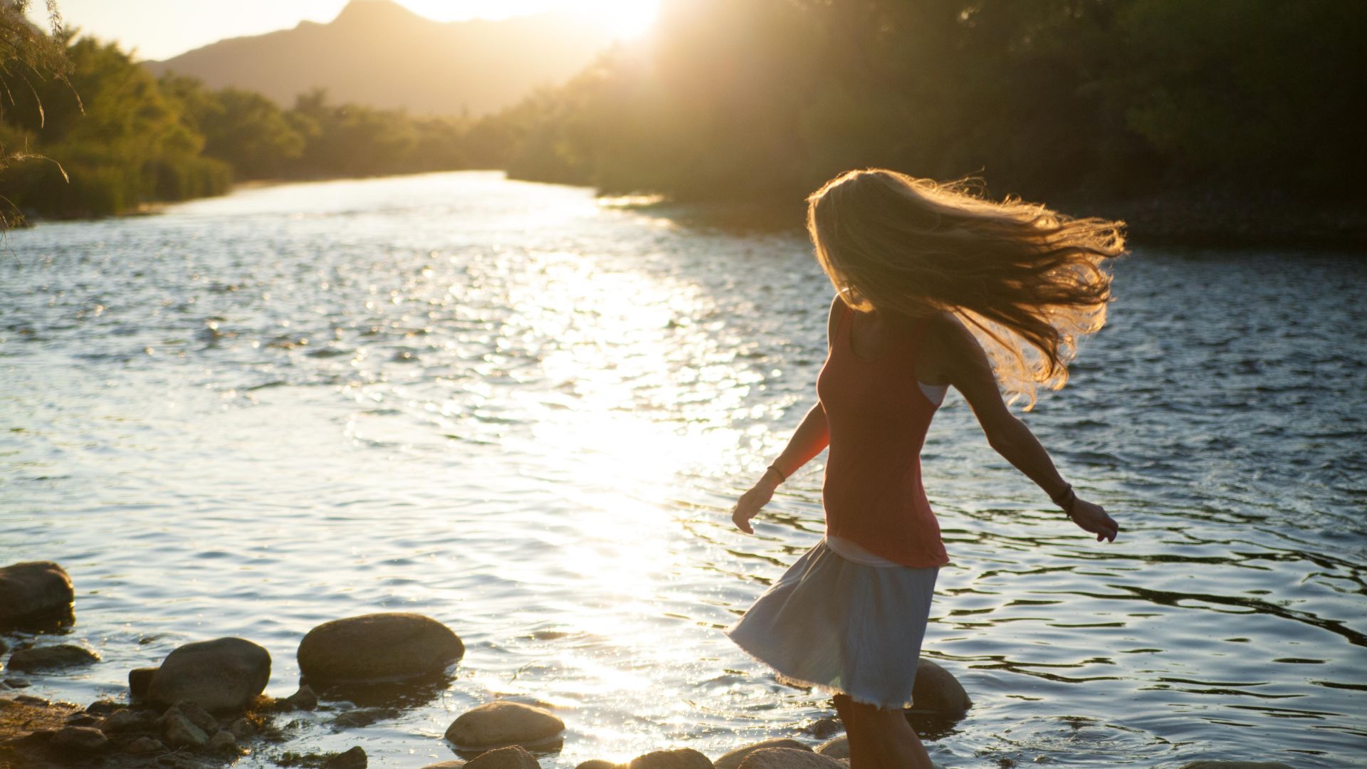 woman dancing by river