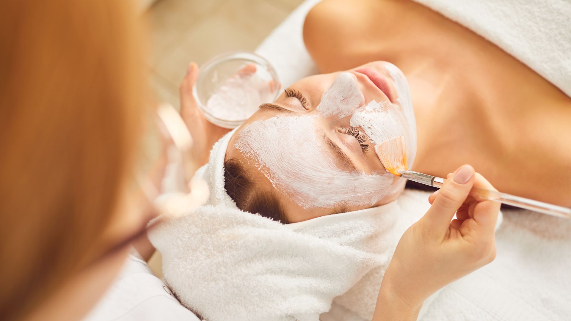 a woman getting a facial