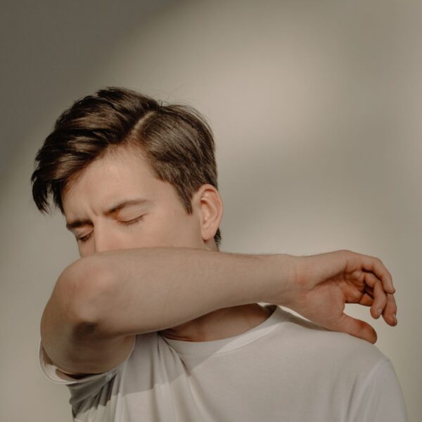 a man covering his mouth