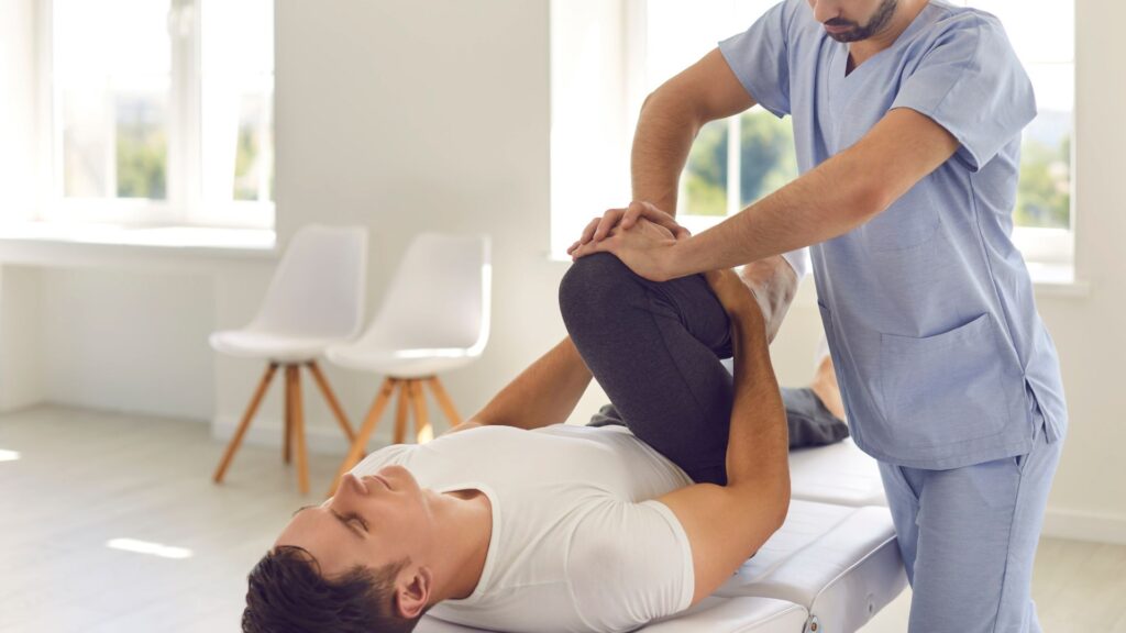 chiropractor with patient