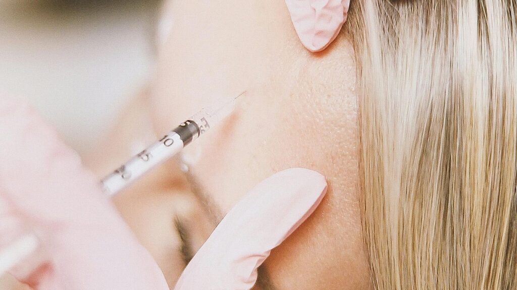 injectable going into a woman's forehead
