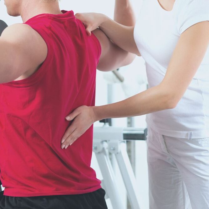 chiropractor working on lower back