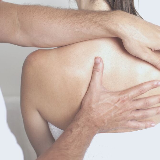 chiropractor working on upper back