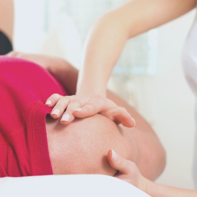 chiropractor working shoulder